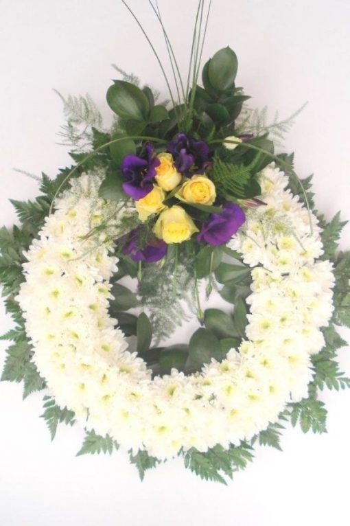 Funeral white wreath w yellow purple