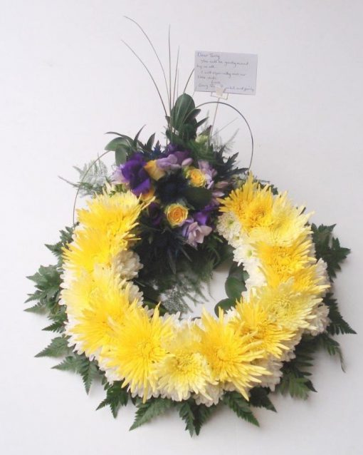 Funeral yellow wreath w purple and white